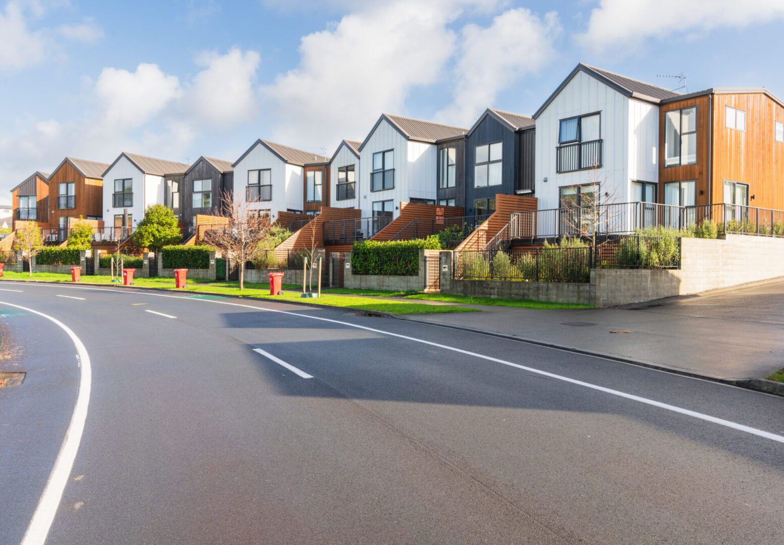 Contemporary homes along curved street