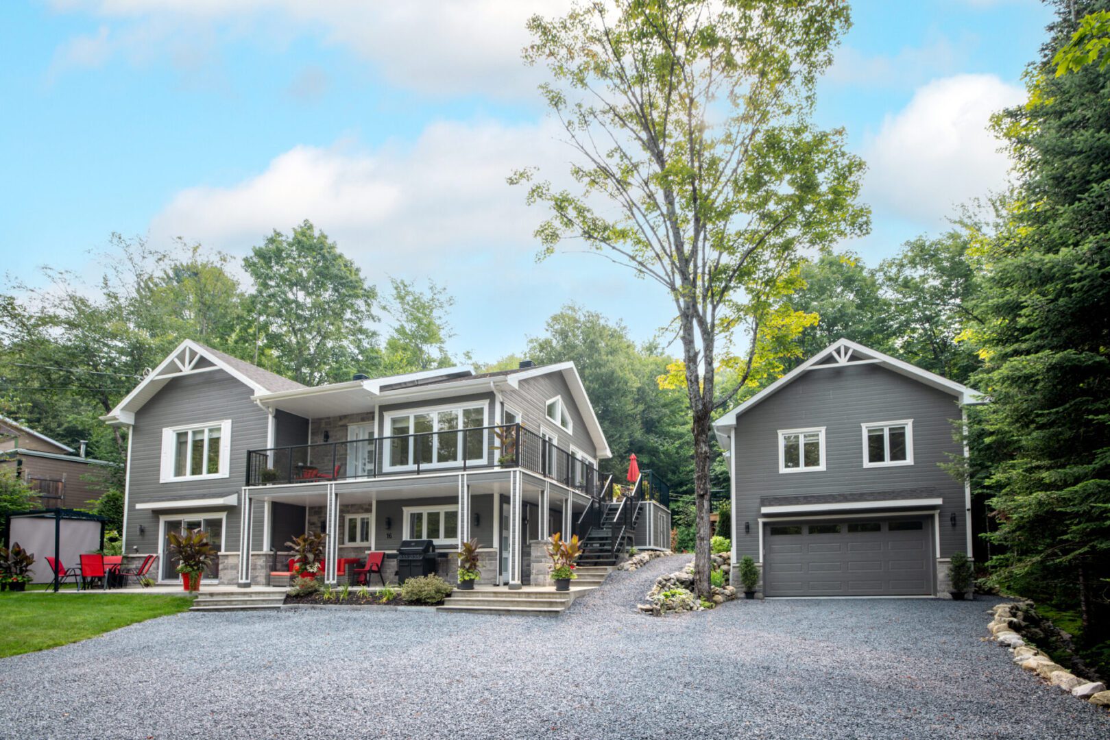 Two-story home surrounded by trees