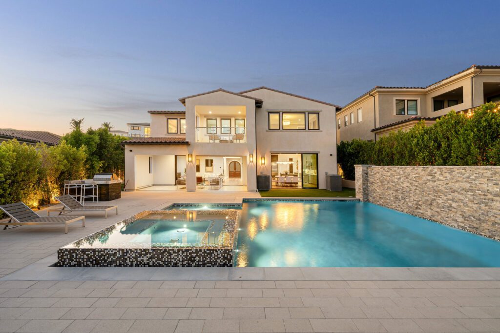 Luxury home with pool at sunset
