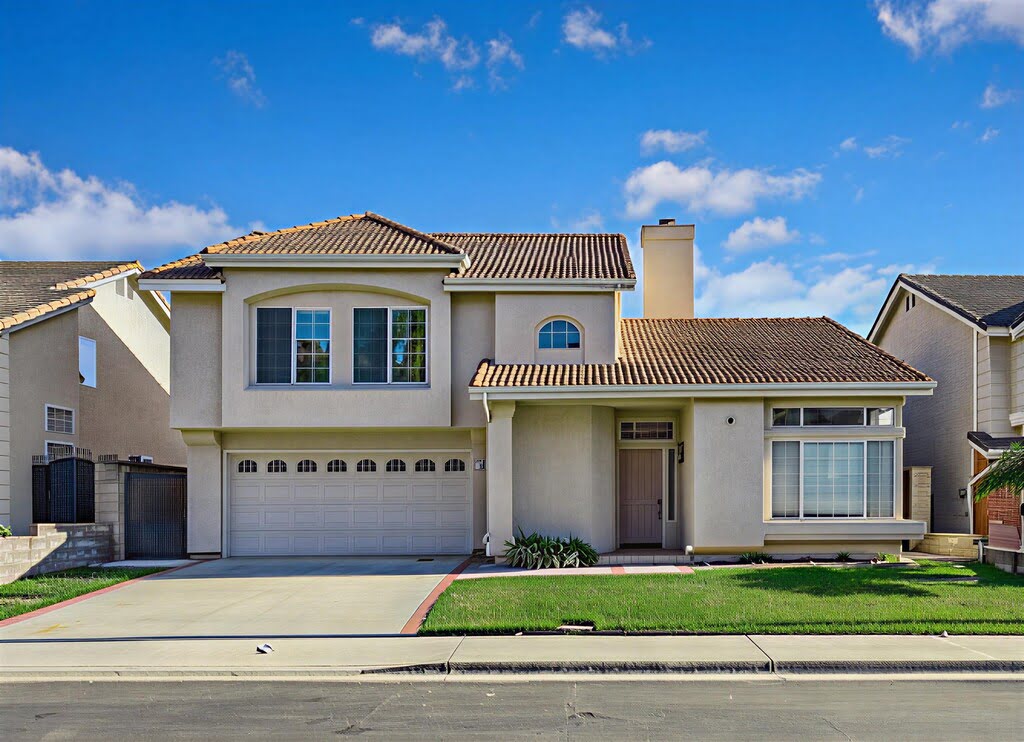 Modern two-story house with a three-car garage and a well-kept front lawn.
